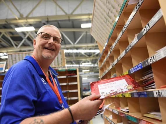 Paul Glossop sorting letters for Santa at Sheffield Mail Centre