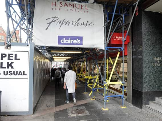 Scaffolding and hoardings along the footpath on Fargate. Picture: Andrew Roe