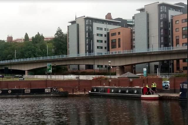 Police officers at Victoria Quays following the discovery of a body