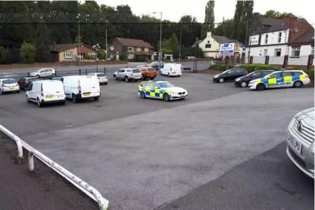 Police at the Car Megastore, Wadsley Bridge, after a raid in which 14 cars were stolen