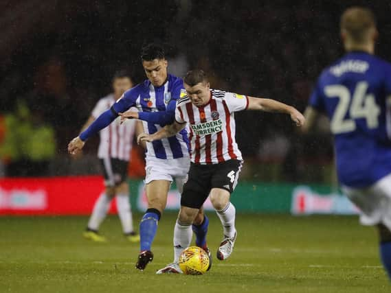 John Fleck takes charge of the midfield during Sheffield United's game against Sheffield Wednesday: Simon Bellis/Sportimage