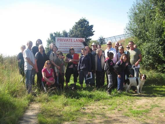 NSST 
Wincobank residents hold protest walk against plans to build houses on open space which they believe was once part of the old Roman Ridge.
Pictured at the development site on Sandstone Road.