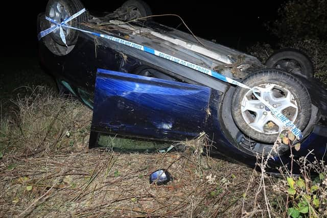 The car landed on its roof in a field this morning (Picture: Sean Stewart)