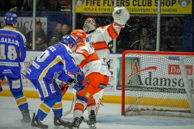 Jackson Whistle reaching for puck