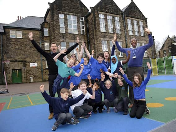 Headteacher Michael Watson along with some staff and members of the school council celebrating the Ofsted report. Pictures Steve Ellis