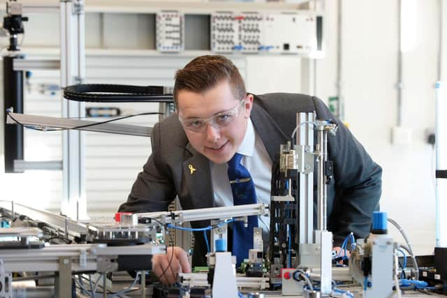 Student Joe Westnedge working on a Festo Automated Production Line