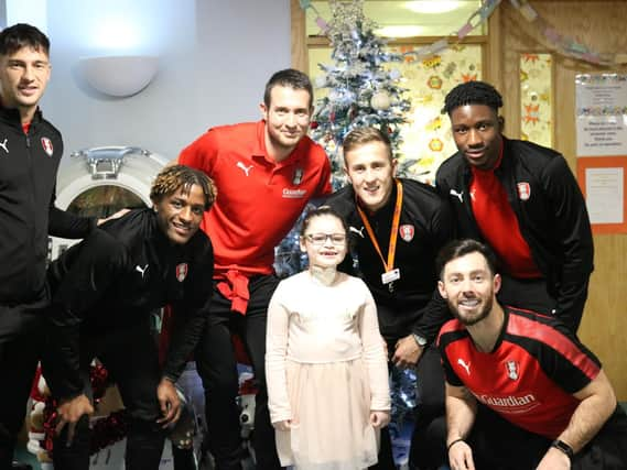 Rotherham United's Will Vaulks, pictured centre, with Millers players and youngsters at Bluebell Wood Children's Hospice