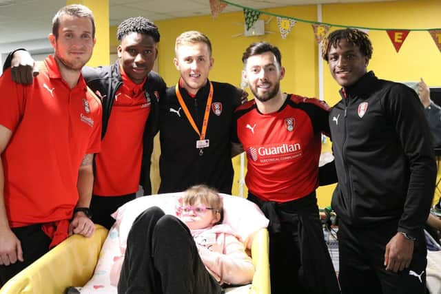 Rotherham United's Will Vaulks, pictured centre, with Millers players and youngsters at Bluebell Wood Children's Hospice