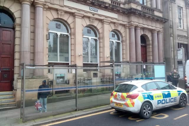 Polie outside the Royal Bank of Scotland, Church Street, following the first robbery. Picture: Sam Cooper / The Star.