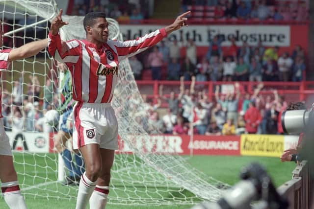 Brian Deane celebrates his historic goal