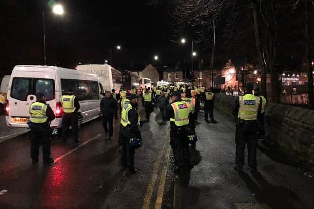 Police wait for fans to leave the ground after the 131st Steel City derby at Hillsborough.