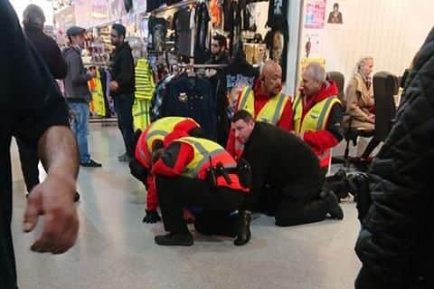 The man being held down in the Moor market this morning.