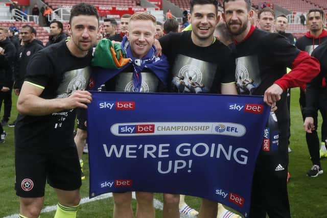 Enda Stevens Mark Duffy John Egan and Jake Wright celebrate Sheffield United's promotion to the Premier League: Simon Bellis/Sportimage