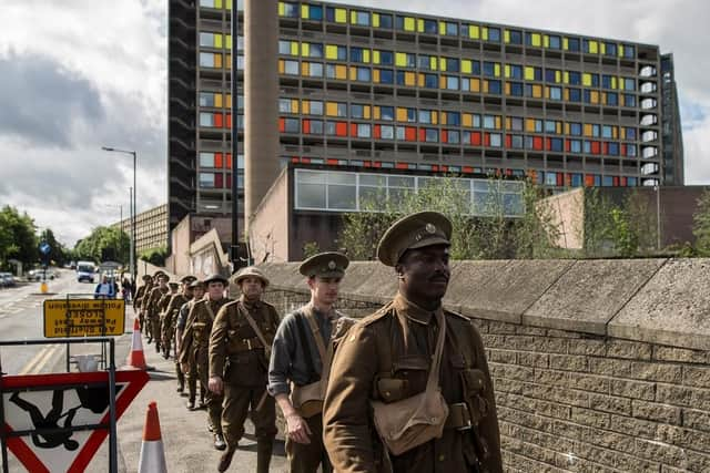 Actors taking part in the World War One 14-18 NOW memorial event We're Here Because We're Here in Sheffield in July 2016