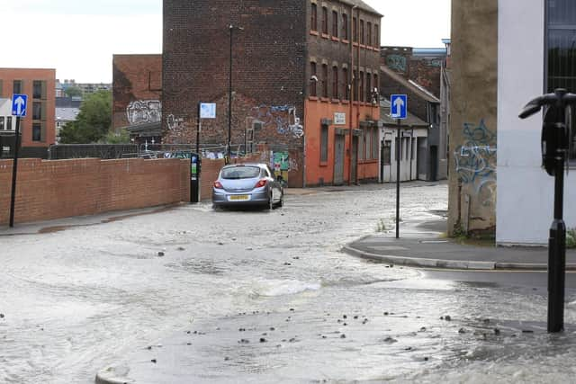 The burst water main on St Mary's Road, Sheffield. Water heading down Mary Street. Picture: Chris Etchells