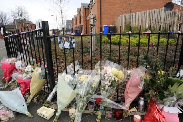 Flowers at the spot where Jarvin Blake was stabbed