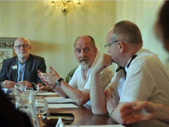 Paul Brooke (centre) was found not to have breached the terms of a civil action banning 'direct action' protests against tree-felling in Sheffield.