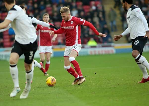 Jason McCarthy tries to find a way through the Derby defence, Barnsley v Derby County, Barnsley, United Kingdom, 9 December 2017. Photo by Glenn Ashley.