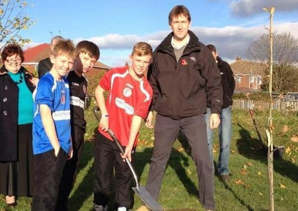 Schoolchildren pictured tree planting with Dan Jarvis