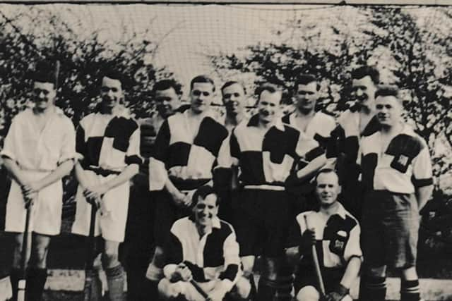 Hockey team including Bernard and Norman Moore, fourth and fifth, middle row, and Clyde Hague fifth from left, back row