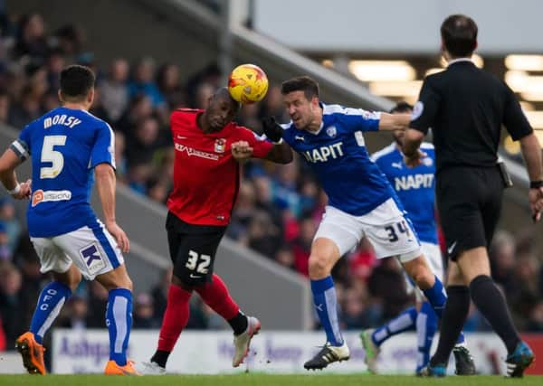 Chesterfield vs Coventry City - Richard Wood battles for a header with Coventry City's Marc Antoine-Fortune - Pic By James Williamson