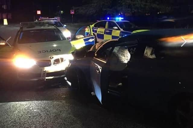 A stolen Volvo crashed into a police car on a roundabout