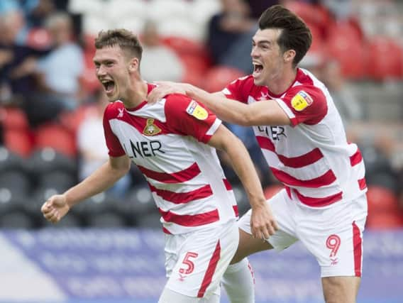 Joe Wright celebrates his goal with John Marquis