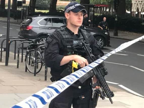 Police activity on Millbank, in central London, after a car crashed into security barriers outside the Houses of Parliament. PRESS ASSOCIATION Photo. Picture date: Tuesday August 14, 2018. See PA story POLICE Westminster. Photo credit should read: Sam Lister/PA Wire