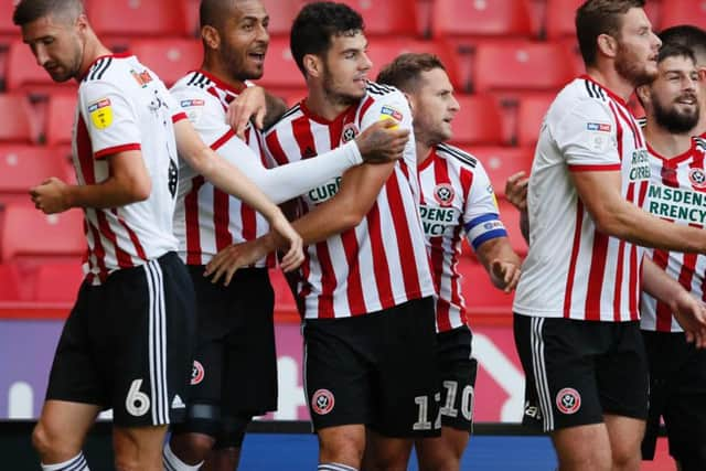 John Egan celebrates his goal