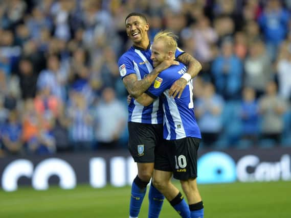 Barry Bannan is congratulated by teammate Liam Palmer.