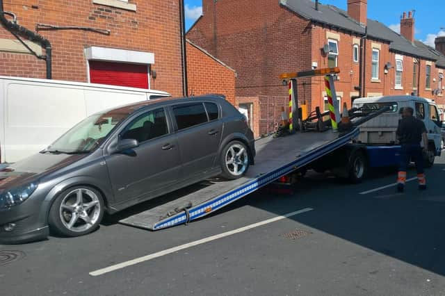 The driver's car being towed away.