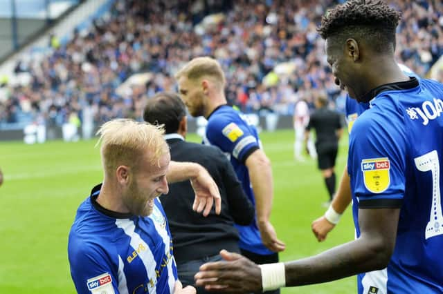 Barry Bannan celebrates his goal with teammate Lucas Joao