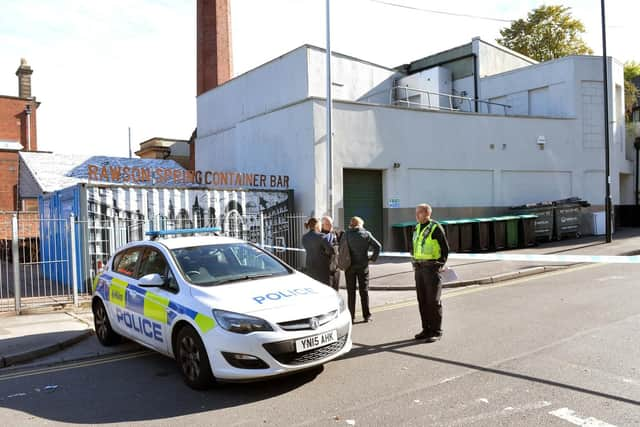 A police cordon at the back of The Rawson Spring pub in Hillsborough following a double stabbing