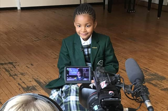 Angel Dusauzay being filmed for Newsround