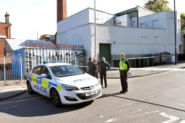 Officers investigating at the scene of a double stabbing in Hillsborough. One of the men who were injured has now sadly died.