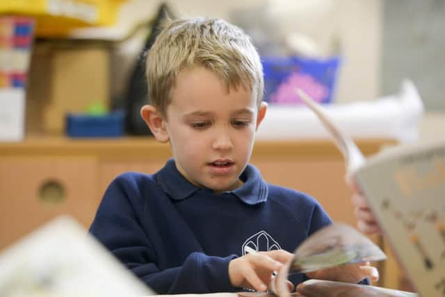 Year three pupils enjoy reading in the library