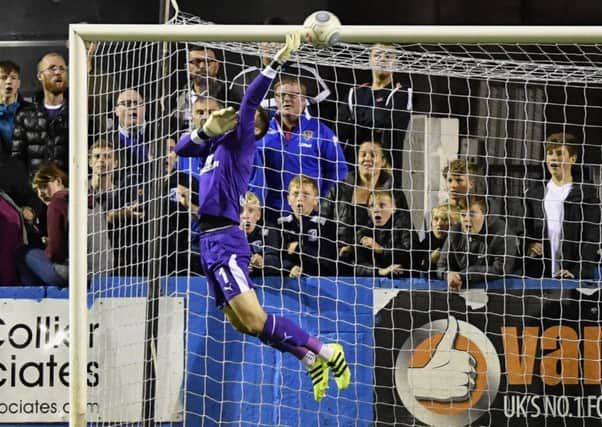 Chesterfield goalkeeper Shwan Jalal tips a long range shot over the bar: Picture by Steve Flynn/AHPIX.com, Football: Vanarama National League match Barrow -V- Chesterfield at Holker Street, Barrow, Cumbria, England copyright picture Howard Roe 07973 739229