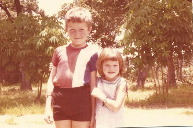 John C Fowler and sister Andrea in the garden of their first home in Zambia