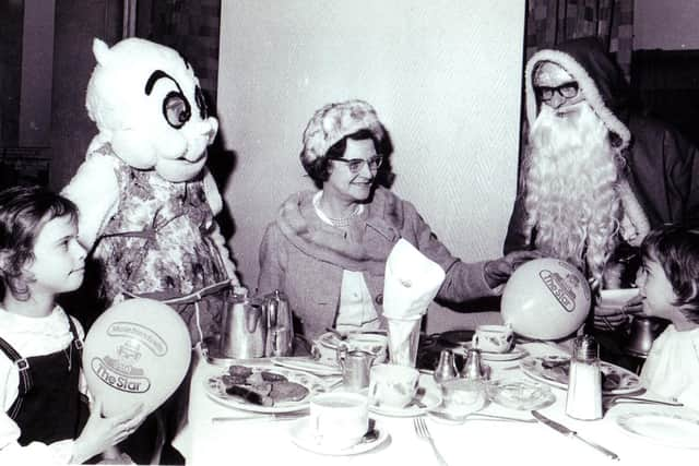 Gloops had breakfast in Cockaynes Restaurant with Father Christmas and young shoppers in the store - picture shows 7 year old twins Nicholas and Caroline Bush of Lodge Moor with their grandmother Nettie Curtis
17th December 1972