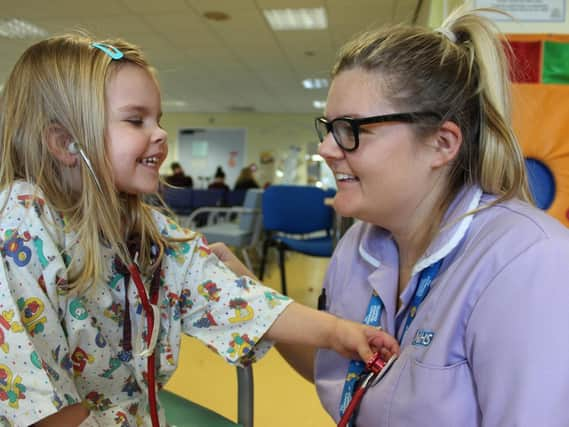 A nurse with a young patient.