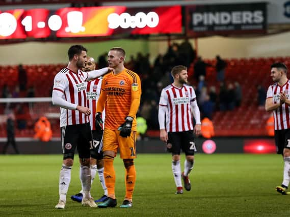 Dean Henderson with Gary Madine: James Wilson/Sportimage