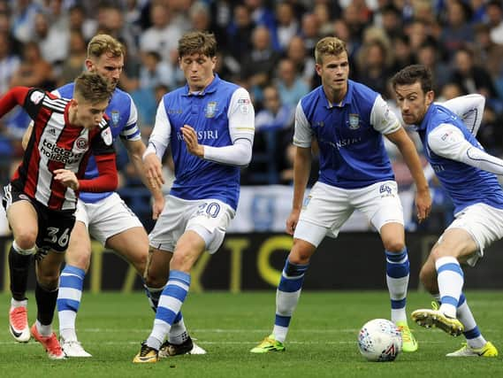 Flashback: Tom Lees, Adam Reach, Joost van Aken and David Jones struggle to keep a grip on David Brooks in the 2017 Steel City derby at Hillsborough