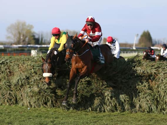 Tiger Roll ridden by Jockey Davy Russell on the way to winning the Randox Health Grand National Handicap Chase during Grand National Day of the 2019 Randox Health Grand National Festival at Aintree Racecourse. PRESS ASSOCIATION Photo. se.