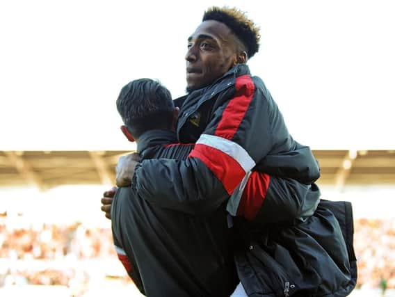 Mallik Wilks celebrate as Rovers secure a play-off spt.