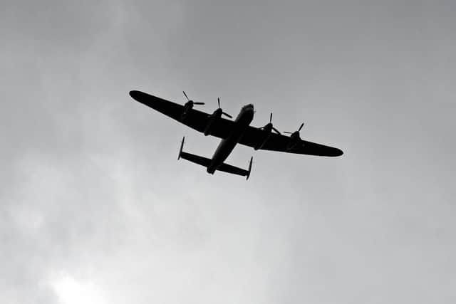 Lancaster Bomber makes a flypast during the service. Picture: Marie Caley NSST-13-06-19-D-Day75Drumheadservice-30