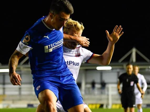 Chesterfield striker Anthony Spyrou has returned to Norwich City.