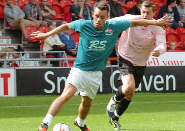 Ex Premiership Legends v Doncaster Charity XI.  Lee Hendrie (left) gets round defender Josh Appleton.  Picture: Malcolm Billingham