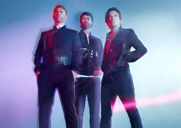 Take That trio Gary Barlow, Howard Donald and Mark Owen