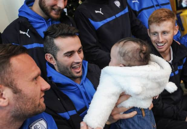 Chesterfield FC visit patients at Chesterfield Royal Hospital - The Den. Pictured with 4mnth Kian Clarridge.