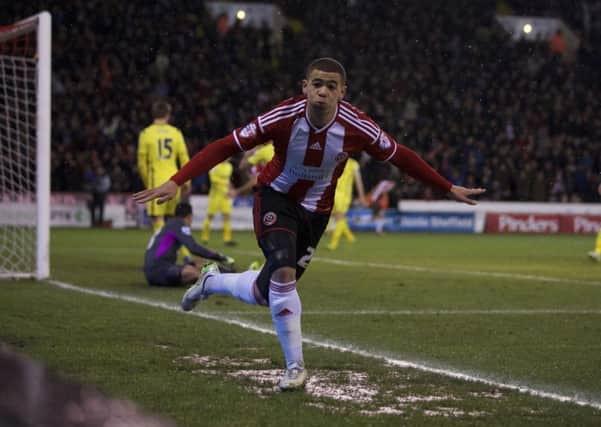 Che Adams celebrates his first goal against Tottenham. Below: Adams is pictured scoring for Ilkeston earlier this season. (Photos by Martyn Harrison and Craig Lamont)